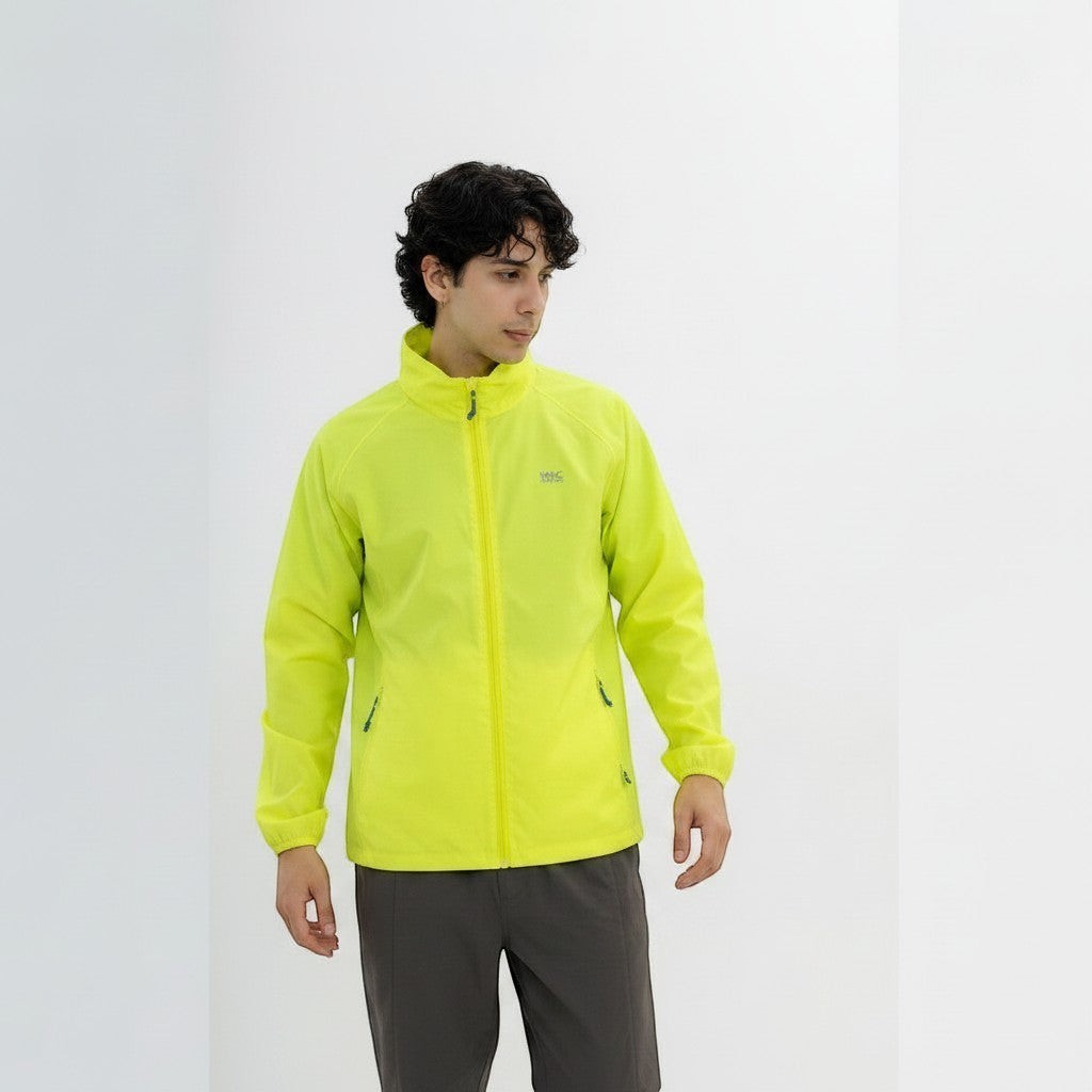 Tsuda Shokai Origin NEON lightweight neon yellow jacket with zip closure and pockets, worn by a man.