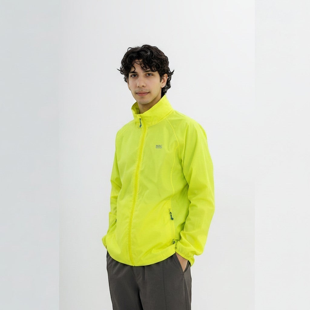 Tsuda Shokai Origin NEON lightweight neon yellow jacket with zip closure and pockets, worn by a man.